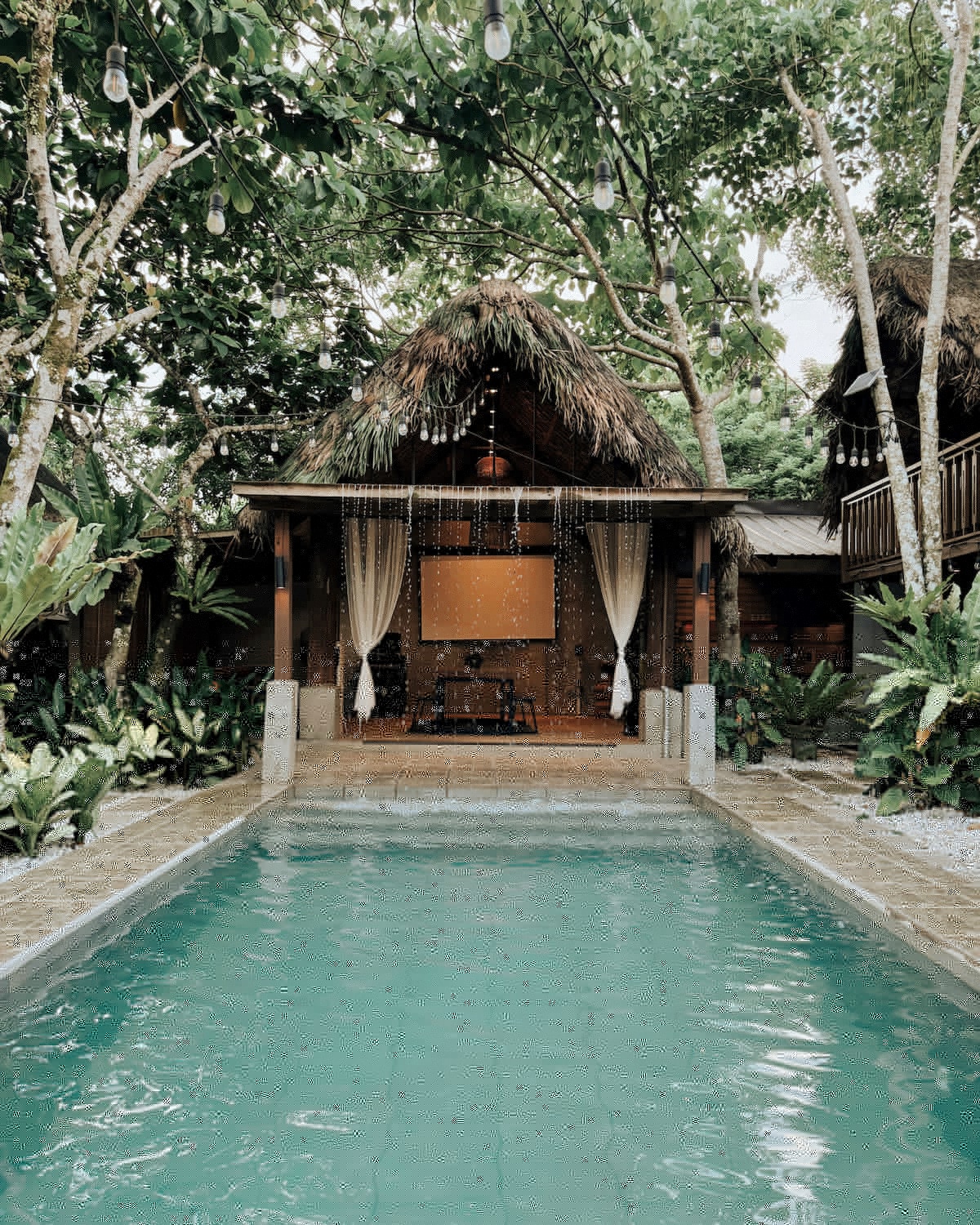 Pool and thatched cabana at Amadeo villa